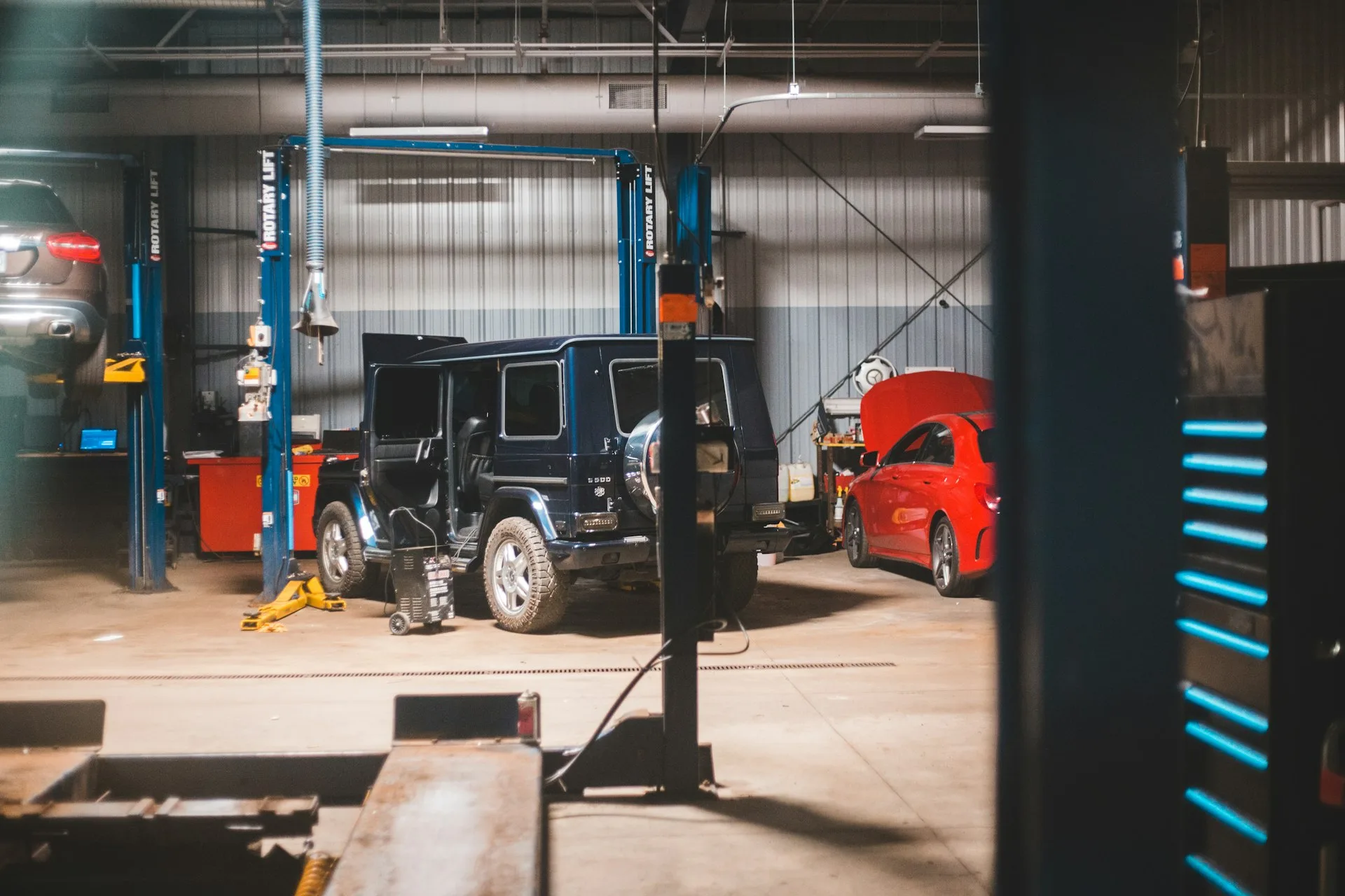 The Rev-Tech Mechanical workshop with vehicles on hoists